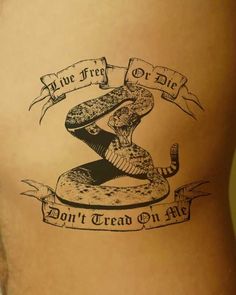 a woman with a tattoo on her stomach that says don't tread on me