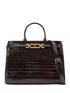 Find TOM FORD Crocodile-embossed Leather Tote Bag on Editorialist. This TOM FORD tote bag is crafted from calf leather with a crocodile effect. It features a signature T-shaped hinge detail, two rolled top handles, an adjustable and detachable shoulder strap, an open top, a partitioned compartment, an internal zip-fastening pocket, an internal logo stamp, a contrast lining, metal feet, and gold-tone hardware. Logo Stamp, Open Top, Leather Tote Bag, Womens Tote Bags, Embossed Leather, Tom Ford, Leather Tote, Calf Leather, Shoulder Strap