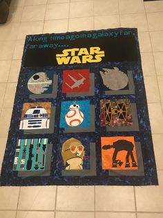 a star wars themed quilt on the floor