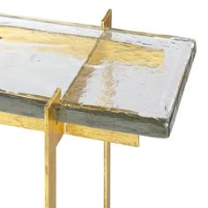 a close up of a metal and wood table with yellow paint on the top surface