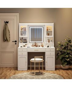 a bathroom vanity with mirror, stool and potted plant