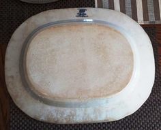 a white plate sitting on top of a wooden table