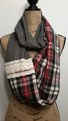 a black and white plaid scarf on a mannequin