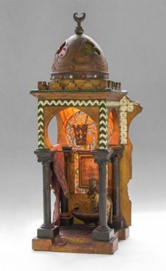 an old fashioned clock with ornate designs on it