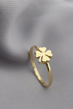 14K Four Leaf Clover Gold Ring, Lucky Shamrock Ring, St. Patrick's Day Jewelry, Clover Leaf Ring, Good Luck Charm Crafted in luxurious 14K gold, this Four Leaf Clover Ring embodies the essence of luck and charm. Symbolizing good fortune and prosperity, the delicate shamrock design makes it a perfect accessory for St. Patrick's Day celebrations or everyday wear. The intricate detailing of the four-leaf clover adds a touch of whimsy and elegance to this exquisite piece of jewelry. Whether worn as Leaf Design Ring, Good Rings, Shamrock Ring, Good Luck Clover, Gold Earrings For Kids, Hand Jewelry Rings, Shamrock Design, Unique Gold Rings, Unique Gold Jewelry Designs