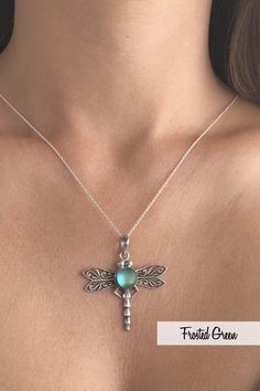 If a dragonfly lands on you, it's good luck! Add some fun to your outfit with this beautifully designed sterling silver and crystal Dragonfly Pendant by LeightWorks. Our handmade necklace is a great statement piece, with glowing crystal surrounded by intricate silver details in the dragonfly wings and body. Wear our pendant on a chain or try it with one of our silver swirl or slide chokers for an even bolder look. Sterling silver components. Sterling silver .7mm box chain, 18" included with pend Elegant Sterling Silver Dragonfly Necklace, Silver Dragonfly Jewelry, Elegant Sterling Silver Dragonfly Jewelry, Handmade Sterling Silver Dragonfly Jewelry, Nickel-free Sterling Silver Dragonfly Jewelry, Bohemian Silver Dragonfly Necklace, Dragonfly Shaped Sterling Silver Jewelry Gift, Sterling Silver Dragonfly Jewelry Gift, Sterling Silver Dragonfly Necklace