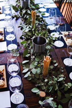 a long table with plates and wine glasses on it