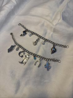 ♡ welcome to the custom charm bracelet shop! ♡ as our business grows, we will be adding more charms and chains, so keep an eye out for new styles! how it works: 1. pick a chain length 2. pick how many charms you would like (maximum of 10; want more than 10? message me!) 3. choose your charms and charm layout 4. in the personalization section, let us know which charms you've picked and how you would like them laid out from left to right. if you don't specify a layout, we'll make sure to make it l Custom Charm Bracelet, Charm Bracelet Silver, Diy Charm, Bracelet Shop, Diy Charm Bracelet, New Charmed, Custom Charms, Silver Chain Bracelet, Bracelet Silver