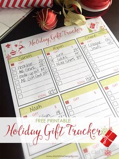 a holiday gift tracker is shown with ornaments and ribbon on the table next to it