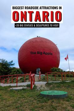 the big apple is located on top of a large red ball in the middle of nowhere