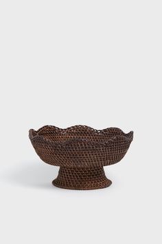 a brown bowl sitting on top of a table