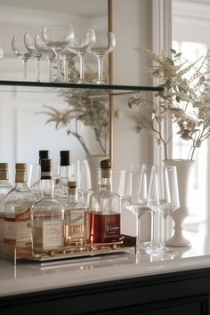 85 Creative DIY Bar Shelf Ideas You'll Love (2024) Vittsjo Bar Hack, Glass Shelves For Bar Area, Wet Bar Glass Shelves, Mirror Bar Shelves, Mirrored Bar Wall With Shelves, Diy Bar Shelf Ideas, Mirrored Bar With Glass Shelves, Bar Shelves Ideas, Diy Bar Shelves