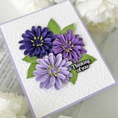 a close up of a card with flowers on it