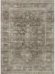 an area rug with various colors and patterns on the floor, including grays, beiges