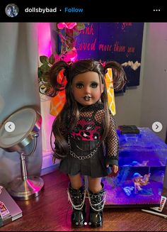 a doll is standing in front of a fish tank wearing boots and holding a chain around her neck