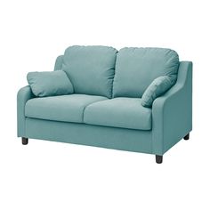 a blue couch with two pillows on it