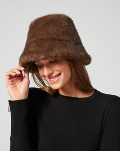 This bucket hat is a true outfit-maker: it's rendered in faux mink fur, so it looks good even as temps drop. Fur Bucket, Faux Fur Bucket Hat, Fur Bucket Hat, Jumpsuit Jacket, Outerwear Vest, Outfit Maker, Mink Fur, Hats For Sale, Skirt Pants