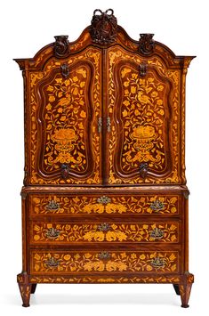 an old wooden cabinet with ornate carvings on it