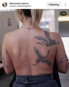 the back of a woman with tattoos on her body