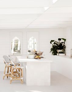 the kitchen is clean and ready to be used for cooking or baking, with all white walls and flooring