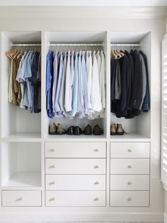 a white closet filled with lots of clothes