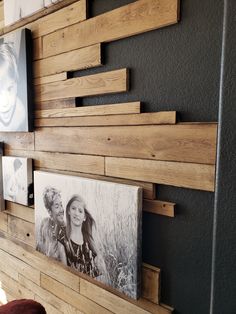 some pictures are hanging on the wall next to each other in a room with wood planks