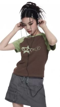 a young woman with headphones on her ears