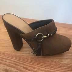 Coach Brown Clogs, Suede With Leather Tassels And Heels, No Size Marked, I Believe They Are A 6.5. Never Worn, Soles And Shoes Are In Excellent Condition Chic Clogs With 4-inch Heel And Round Toe, Brown Leather Clogs With 4-inch Heel, Leather Clogs With 4-inch Block Heel, Suede Mules With Reinforced Heel And Round Toe, Brown Mules With 4-inch Heel And Round Toe, Coach Casual Closed Toe Heels, Casual Coach Closed Toe Heels, Casual Closed Toe Coach Heels, Coach Leather Mules With Round Toe