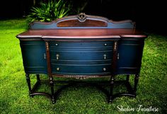 an old dresser is painted blue and brown