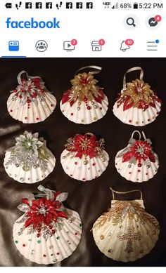 six seashells are decorated with red bows and jewels on them, all in different styles