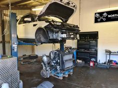 a car being worked on in a garage