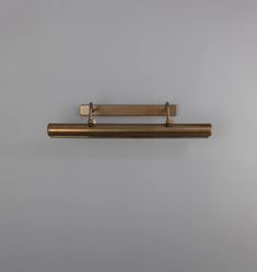 a metal shelf mounted to the side of a wall