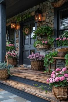 the front porch is decorated with potted flowers and wicker baskets on the steps