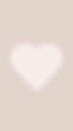 a white heart shaped object on a light gray background with the word love written below it