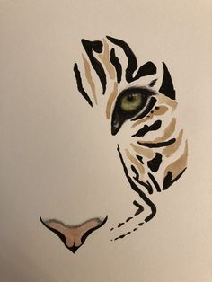 a drawing of a tiger's face with green eyes