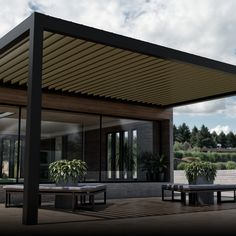 an outdoor covered patio with picnic tables and benches