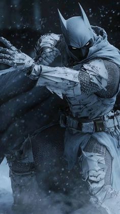 batman in the snow with his hands out to grab something from another person's hand