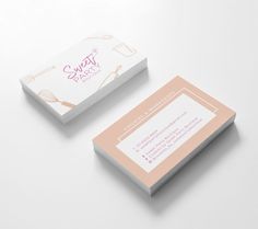 two business cards designed to look like they are made out of white and pink paper