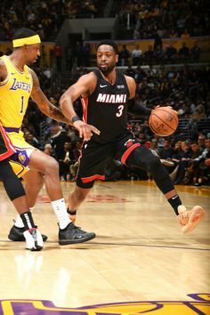 two basketball players in action on the court