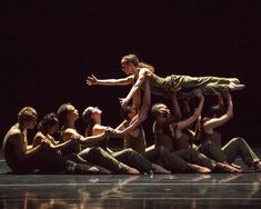 a group of people sitting on top of each other