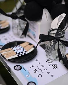 mickey mouse party favors and decorations on a table