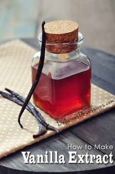 a glass jar filled with liquid sitting on top of a wooden table