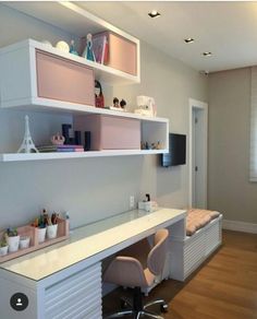 a room with a desk, chair and shelves on the wall next to a window