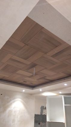 an unfinished ceiling in a room with white walls