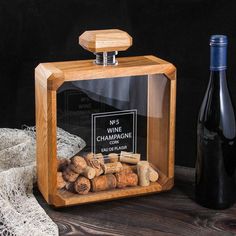 a bottle of wine and some corks on a table