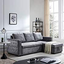 a living room with a gray couch and white rugs on the floor next to a coffee table