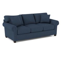 a blue couch sitting on top of a white floor