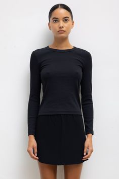 #color_black Sleek Long Sleeve Top With Thumbholes, Fitted Long Sleeve Crew Neck Top For Layering, Sleek Long Sleeve Tops For Fall, Sleek Fitted Long Sleeve Top For Fall, Elastane Long Sleeve Top For Layering, Long Sleeve Tops With Thumbholes, Long Sleeve Tops With Thumbholes And Minimal Stretch, Long Sleeve Top With Thumbholes And Minimal Stretch, Sleek Fall Tops With Minimal Stretch