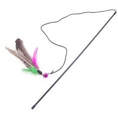 an arrow and some feathers on a white surface with a black string attached to it