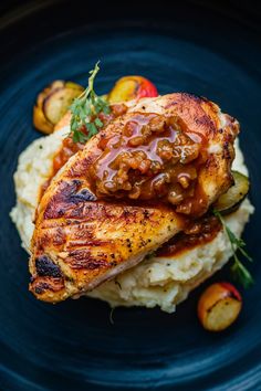 Grilled chicken breast topped with sauce on a bed of mashed potatoes, garnished with roasted vegetables. Juicy Chicken Breast, Chicken Sauce, Sauce For Chicken, Food Photography Inspiration